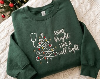 Embroidered Christmas Nurse Sweatshirt, Shine Bright Like A Call Light, Christmas Nurse Tree Shirt, Merry Nurse Shirt, Merry Christmas Nurse
