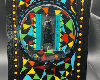 Beetle  collage featuring hand-painted patterns, bright colors and dimensional construction; inspired by museum specimen displays.
