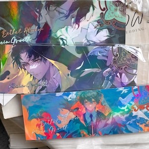 May include: Three rectangular holographic bookmarks featuring anime-style illustrations of characters. The top and bottom bookmarks display the text Bethel Abraham, while the middle bookmark features the text Klein Moretti in cursive script.