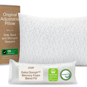 May include: A white rectangular pillow with a geometric triangle pattern, a brown cardboard box labeled COOP Original Adjustable Pillow, and a clear plastic bag containing Extra Oomph Memory Foam Blend Fill with green certification logos.