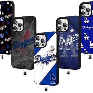 May include: A collection of five phone cases featuring the Los Angeles Dodgers baseball team logo and branding. Designs include the team name, the letter "LA", and baseball imagery. The cases are in various colors, including black, blue, and white.