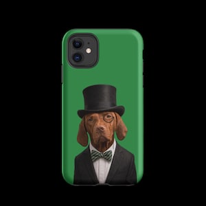 May include: A green smartphone case featuring a graphic of a brown dog wearing a black top hat, a monocle over one eye, a white collared shirt, and a green and white striped bow tie, all set against a solid green background on the case.