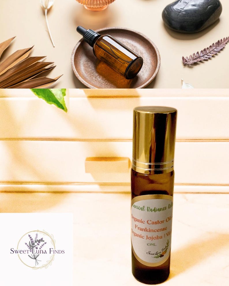 May include: An amber glass bottle with a dropper sits on a wooden plate, alongside a roll-on bottle with a gold cap. The roll-on bottle has a label that reads "Botanical Radiance Oil" and lists ingredients. The background features decorative elements.