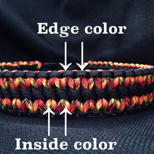Pu&ograve; includere: Un braccialetto in paracord nero con un design a motivi rossi, gialli e neri. Il bordo del braccialetto &egrave; nero e l'interno &egrave; rosso, giallo e nero.