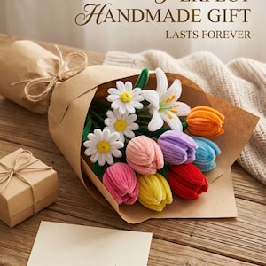 May include: A handmade bouquet of colorful fabric flowers, including daisies, lilies, and tulips, wrapped in brown paper. A small gift box and a blank card with a pen are also present. The text reads "Perfect Handmade Gift Lasts Forever."
