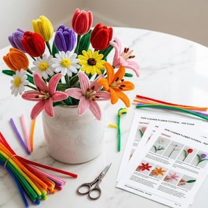 May include: A colorful bouquet of pipe cleaner flowers in a white vase, including tulips, daisies, and lilies. Bundles of pipe cleaners in various colors, scissors, and printed tutorials are also present.