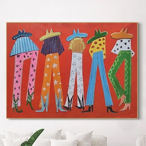 May include: An abstract painting on a red background features five figures with elongated legs and cowboy hats. The figures wear patterned pants in various colors, including pink, orange, blue, and green, with star and floral designs. The artwork is displayed above a white sofa.