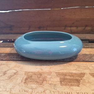 May include: A handmade wooden sign with the text "Welcome" in a playful font. The sign features a distressed white background and a dark brown frame, perfect for a front door or entryway. The sign measures approximately 12 inches wide and 6 inches tall.