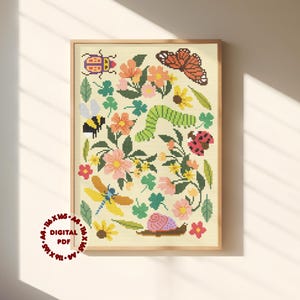 Könnte beinhalten: Ein gerahmtes Kreuzstichmuster mit einer farbenfrohen Gartenszene mit Blumen und Insekten. Das Design umfasst einen Schmetterling, eine Biene, einen Marienkäfer und eine Schnecke, mit dem Text "DIGITAL PDF". Der Hintergrund ist hellbeige.