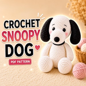 May include: A white and black crocheted dog toy with pink cheeks, black ears, and a black nose. The text CROCHET SNOOPY DOG with a heart icon and a red button labeled PDF PATTERN are displayed to the left of the toy on a light beige background.