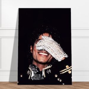 May include: A vertical rectangular wall art print featuring a portrait of Michael Jackson smiling. He is wearing a black military-style jacket with gold accents and a signature white sequined glove covering his eyes against a solid black background.