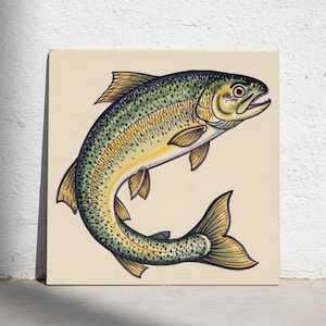 May include: A square ceramic tile featuring a hand-painted illustration of a trout in a leaping position. The fish displays a gradient of green, yellow, and cream tones with dark spots along its body, fins, and tail, set against a cream background.
