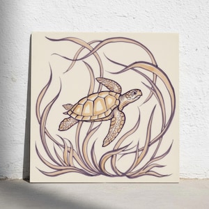 May include: A square decorative tile featuring a central illustration of a sea turtle swimming through flowing seagrass. The turtle is rendered in shades of tan and brown, while the surrounding aquatic plants are outlined in dark purple.
