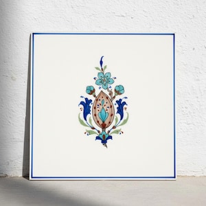 May include: A square white ceramic tile featuring a central hand-painted floral motif in shades of turquoise, dark blue, and tan. The design includes a central almond-shaped element surrounded by stylized leaves and blossoms, framed by a thin blue border.