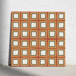 May include: A square decorative tile featuring a repeating geometric pattern of off-white squares centred within mustard yellow frames, all set against a deep terracotta red background with dark grey outlines defining each individual square shape.