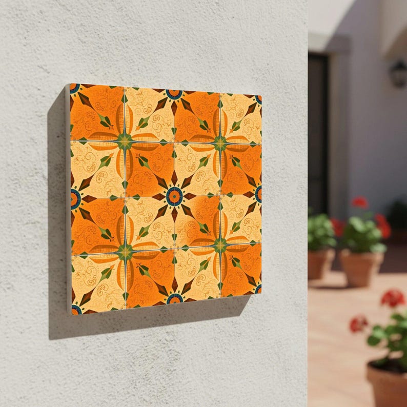 Warm terracotta and cream ceramic wall tile with green star medallion and Mediterranean scroll details.