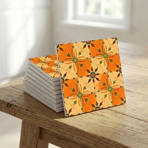 Spanish Levante style ceramic wall tile with symmetrical cross rosette in earthy citrus tones.