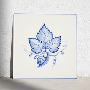 May include: A square ceramic tile featuring a blue and white illustration of a snail crawling on a vine with a large, detailed grape leaf. The design is centered on a white background with a thin blue border framing the entire square tile.