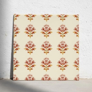 May include: A square ceramic tile featuring a repeating pattern of stylized thistle motifs in shades of deep red and golden yellow. The design is arranged in a grid on a cream-colored background, creating a symmetrical and uniform floral display.