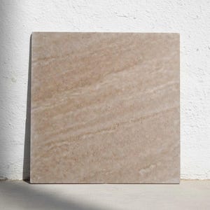 May include: A set of three ceramic mugs with a speckled, matte finish. The mugs are in shades of cream, light gray, and dark gray. Each mug has a simple, minimalist design, perfect for coffee or tea.