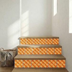 May include: Wooden staircase with decorative tiles featuring an orange and yellow floral pattern. The tiles are installed on the risers of the steps. A woven basket with a blanket is visible in the corner.
