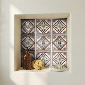 Cádiz style blue and gold ceramic tile used as Mediterranean bathroom accent wall.