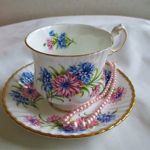 Paragon Tea cup & Saucer, Beautiful Floral Pattern on Ribbed White Background, Gold Rims, Bone English China made in 1960s.