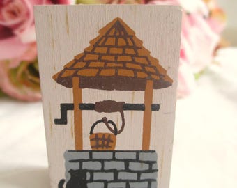 Estante para accesorios con forma de pozo de los deseos The Cat's Meow