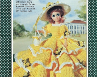 May include: Crochet pattern for a yellow antebellum gown and hoop slip for a 15-inch fashion doll. The pattern is titled "Southern Belle" and is part of the "American Heritage Collection".