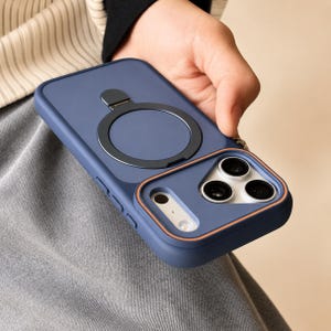 May include: A matte navy blue smartphone case featuring a circular magnetic ring stand on the back and a raised camera lens protector frame with a thin orange accent line. The case has a smooth finish and covers the back and sides of the device.