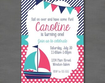 May include: A pink and blue nautical themed birthday invitation for a girl named Caroline turning one. The invitation features a sailboat with a pink sail and a turquoise hull. The background is a pink and white polka dot pattern with blue and white stripes.