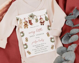May include: A light pink long-sleeved baby bodysuit featuring a white card with Christmas-themed illustrations of teddy bears, stockings, and Santa Claus. The text reads: merry little BABY SHOWER honoring jordyn landry, Saturday, December 12th @ 3 pm.