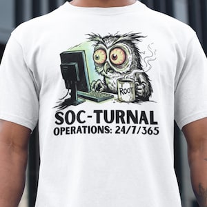 May include: White t-shirt featuring a cartoon owl with large, red-rimmed eyes, working on a computer. The owl holds a mug that says "ROOT." The shirt also has the text "SOC-TURNAL OPERATIONS: 24/7/365."