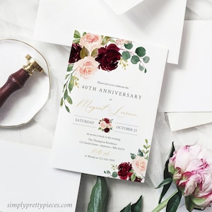 May include: A white invitation card with a floral design in shades of pink and burgundy. The text reads "Please join us to celebrate the 40th Anniversary of Margaret & Lawrence. Saturday, October 25. At seven o'clock in the evening, The Thompson Residence, 123 Smith Street, Anytown, MN 45678. RSVP to Wendy at 123-456-7890."