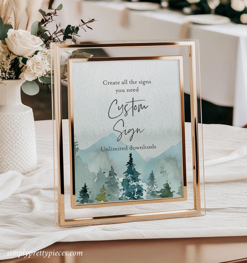 May include: A gold-framed sign with a watercolor background of a forest scene. The text on the sign reads "Create all the signs you need Custom Sign Unlimited downloads".