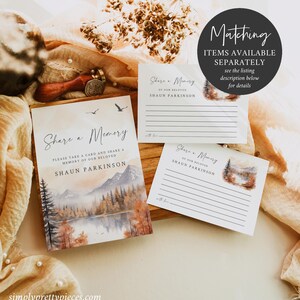 May include: A set of two cards with a watercolor illustration of a mountain lake and forest scene. The cards say "Share a Memory of our Beloved Shaun Parkinson".