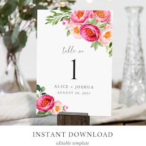 May include: A printable table number card with a floral design featuring pink and peach peonies. The card has the text "table no. 1" and "ALICE + JOSHUA AUGUST 20, 2023".