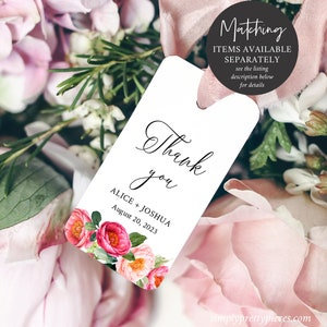 May include: White thank you tag with pink floral design. The tag says "Thank you" in cursive script and "ALICE + JOSHUA August 20, 2023".