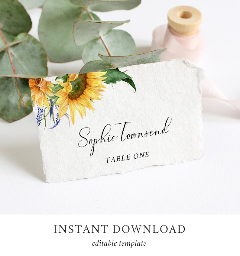 May include: A printable wedding table card with a watercolor sunflower design. The card says "Sophie Townsend, Table One".