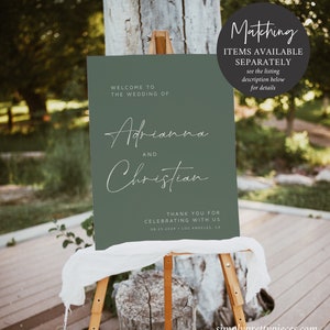 May include: A green welcome sign with white text announcing the wedding of Adrianna and Christian. The sign includes the date and location of the wedding: 08.25.2024 Los Angeles, CA.