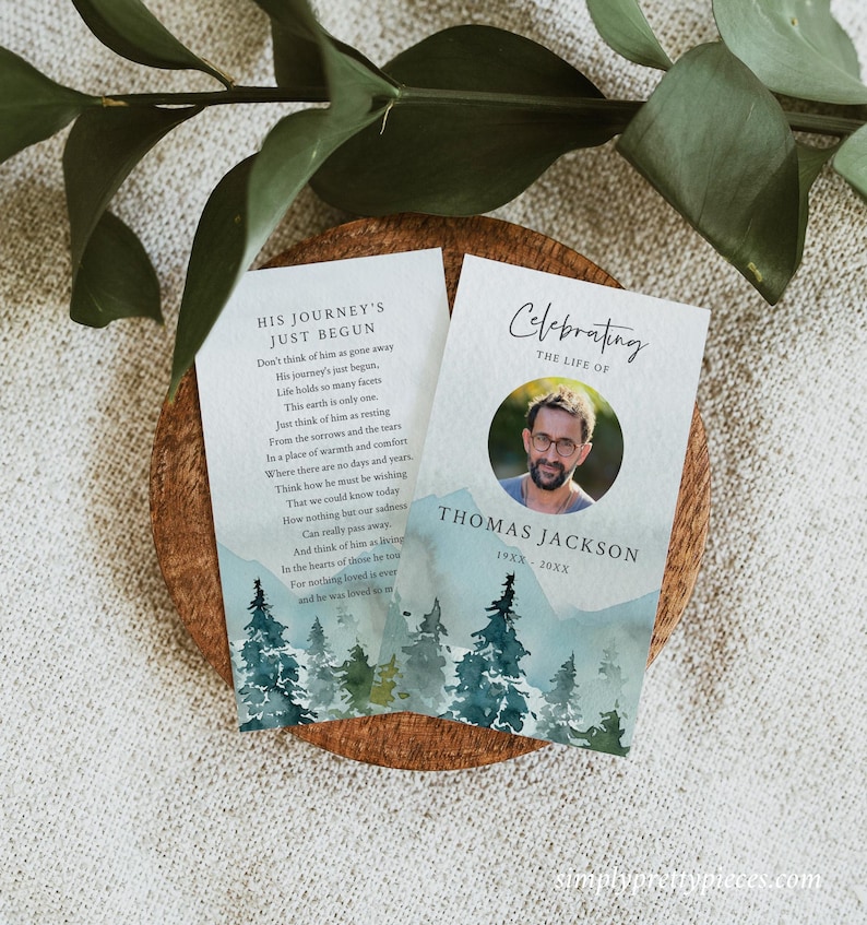 May include: Two memorial cards with a watercolor background of a forest scene. The top card has a poem about a person's journey continuing after death. The bottom card has a photo of a man and the text "Celebrating the Life of Thomas Jackson 19XX-20XX".