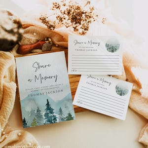 May include: Three watercolor-style cards with a mountain and forest scene. The cards say "Share a Memory" and have a space to write a memory of the deceased. The name "Thomas Jackson" is printed on each card.