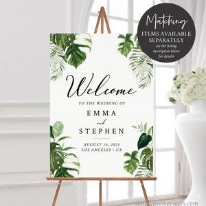 May include: Welcome sign with tropical leaves and the text "Welcome to the wedding of Emma and Stephen, August 16, 2021, Los Angeles, CA".