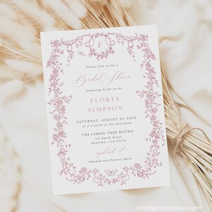 May include: A pink floral design wedding shower invitation with the text "Please join us for a Bridal Shower honoring bride-to-be Floria Simpson. Saturday, August 20, 20XX at 3 o'clock in the afternoon. The Lemon Tree Bistro 123 Smith Street Anytown, CA 45678 Registered at Amazon and Pottery Barn."