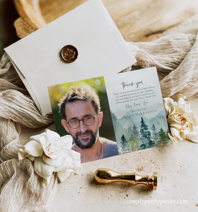 May include: Thank you card with a watercolor illustration of a forest and a photo of a man wearing glasses. The text on the card reads "Thank you. There are not enough words to fully express our heartfelt gratitude for the sympathy, love and support you have extended to our family during this time of loss. Thank you."  The family of Shaun Parkinson.