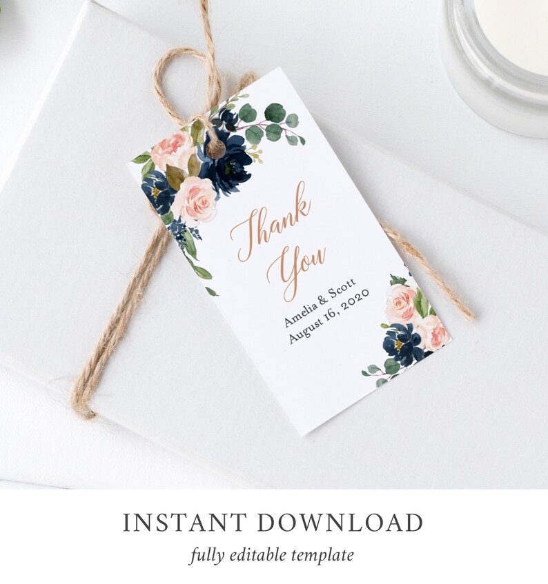 May include: A white thank you tag with a navy blue and blush floral design. The text reads "Thank You" in gold script with "Amelia & Scott August 16, 2020" below.