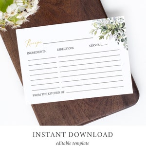 May include: A white recipe card with gold script and a watercolor floral design. The card has lines for ingredients, directions, and servings. The words "Recipe", "Ingredients", "Directions", "Serves", and "From the kitchen of" are printed on the card. The words "INSTANT DOWNLOAD" and "editable template" are printed at the bottom.