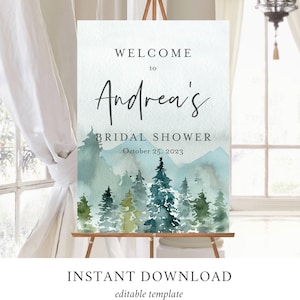 Op de afbeelding: Een afdrukbaar welkomsbord voor een bruidsdouche met een aquarel achtergrond met een bos sc&egrave;ne met bergen en bomen. De tekst luidt "Welkom bij Andrea's Bridal Shower op 25 oktober 2023".