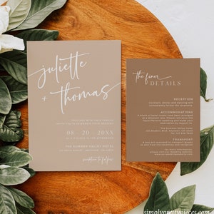 May include: A beige wedding invitation suite with white calligraphy. The top card reads "juliette + thomas" and the bottom card reads "The finer details" with information about the reception, accommodations, and transportation.