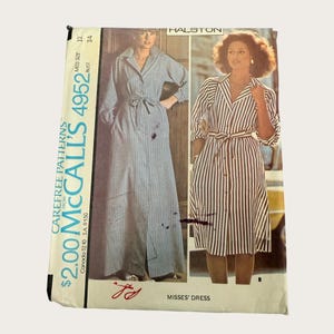May include: A vintage McCall's 4952 sewing pattern envelope for a misses' dress designed by Halston. The packaging features two illustrations of a button-front dress with a tie waist, one in a long floor-length style and one in a midi length.